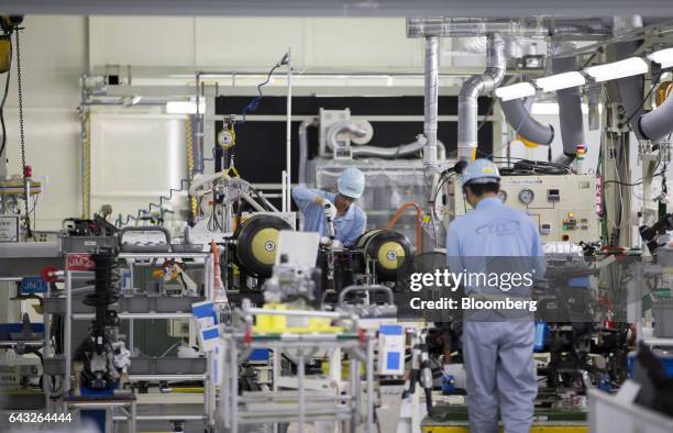 Toyota Motor Corp. Workers assemble hydrogen tanks for a Mirai fuel-cell vehicle on the production line of the company's Motomachi plant in Toyota...