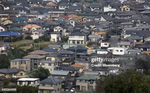 Houses stand in Toyota City, Aichi, Japan, on Friday, Oct. 14, 2016. Toyota Motor Corp. Plans to rely on hydrogen to all but rid its lineup of...