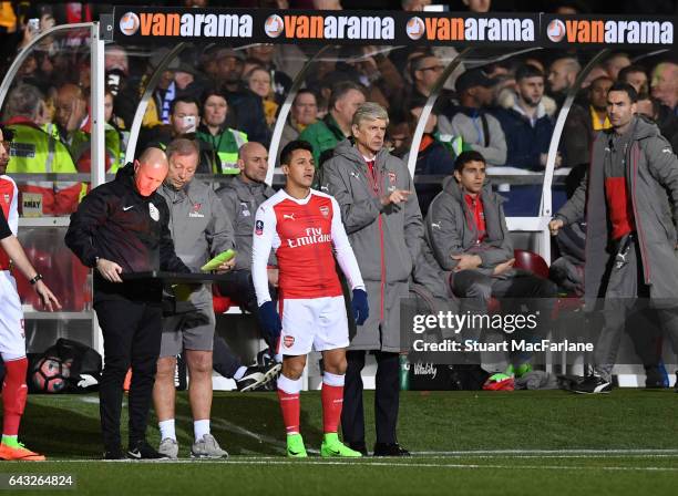Arsenal manager Arsene Wenger with substitute Alexis Sanchez during the Emirates FA Cup Fifth Round match between Sutton United and Arsenal on...