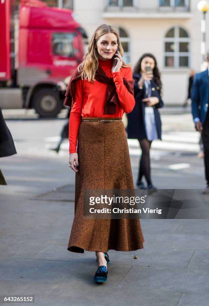 Olivia Palermo wearing an orange red longshirt, brown skirt outside Pringle of Scotland on day 4 of the London Fashion Week February 2017 collections...