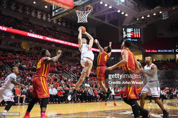 Matthew Temple of the Texas Tech Red Raiders goes to the basket against Donovan Jackson of the Iowa State Cyclones during the game on February 20,...