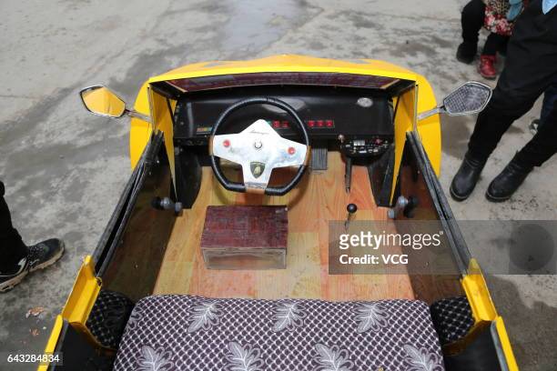The miniature Lamborghini made by Chinese farmer Guo Liangyuan is seen on the street on February 21, 2017 in Zhengzhou, Henan Province of China....