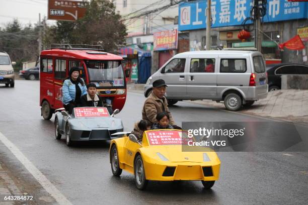 Farmer called Guo Liangyuan and his wife drive his miniature Lamborghini on the street on February 21, 2017 in Zhengzhou, Henan Province of China....