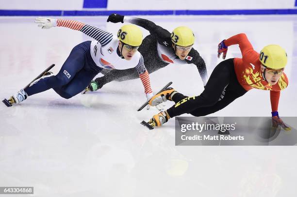 Seungsoo Han of Korea, Keita Watanabe of Japan and Ziwei Ren of China competes in the Men's 500 metre Short Track Speed Skating on day four of the...