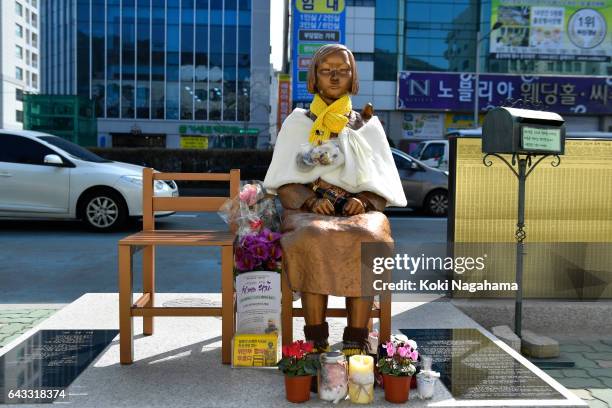 The statue of a girl symbolizing 'comfort women' is seen in front of the Japanese consulate-general on February 21, 2017 in Busan, South Korea....