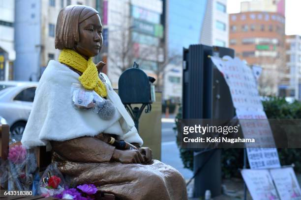 The statue of a girl symbolizing 'comfort women' is seen in front of the Japanese consulate-general on February 21, 2017 in Busan, South Korea....