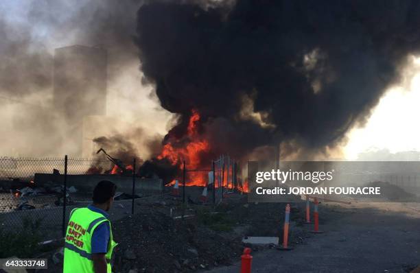 This frame grab taken from AFPTV of video received from Jordan Fouracre on February 21, 2017 shows smoke and flames after a twin-engined Beechcraft...