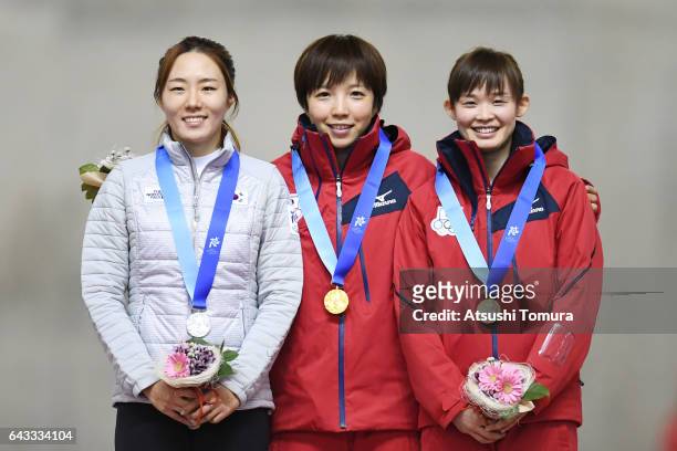 Sang-Hwa Lee of South Korea , Nao Kodaira of Japan and Arisa Go of Japan pose on the podium during award ceremony for the Speed Skating ladies 500m...