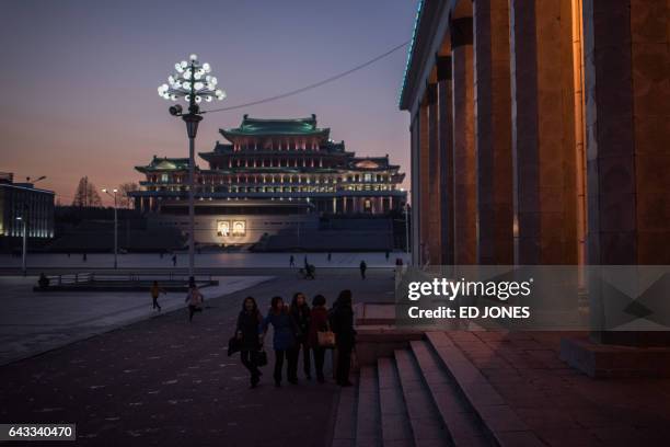 In a photo taken on February 18, 2017 a group of students walk before the steps of the Korean Central History Museum on Kim Il-Sung sqaure in...