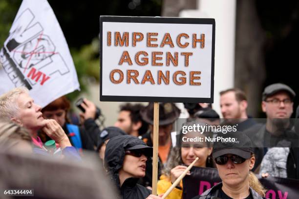 Anti-Trump protesters during the Not My President's Day rally in Los Angeles, California on February 20, 2017. Protesters denounced a variety of...