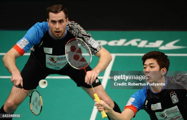 Lee Yong Dae and Ivanov Vladimir of Musica Champions Indonesia compete against Sabar Karyaman Gutama and Franky Wijaya Putra of Tjakrindo Masters...