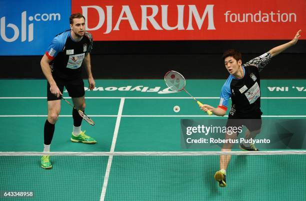 Lee Yong Dae and Ivanov Vladimir of Musica Champions Indonesia compete against Sabar Karyaman Gutama and Franky Wijaya Putra of Tjakrindo Masters...