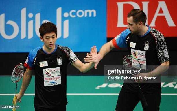 Lee Yong Dae and Ivanov Vladimir of Musica Champions Indonesia react against Sabar Karyaman Gutama and Franky Wijaya Putra of Tjakrindo Masters...