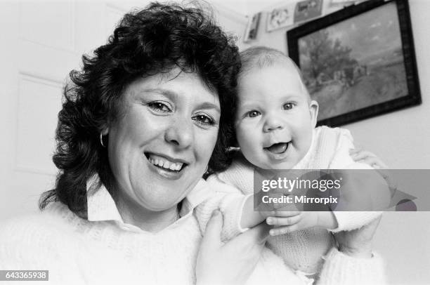 Mrs Christine Lacey and her baby son Samuel - 4 months old - pictured at home in Nottingham, 4th January 1985.Mrs Christine Lacey and her baby son...