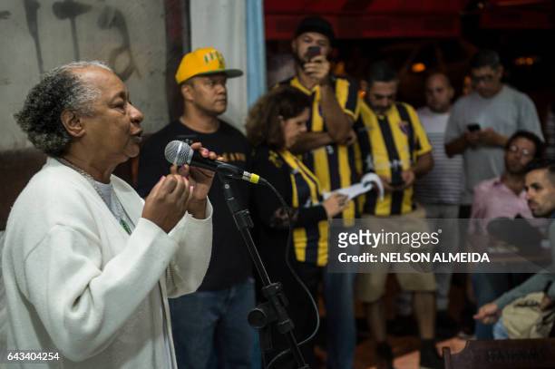 Members of the Cultural Cooperative of the Periphery gather to recite and listen to poems at a bar in Capao Redondo, on the outskirts of Sao Paulo,...