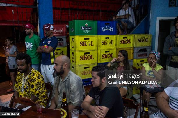 Members of the Cultural Cooperative of the Periphery gather to recite and listen to poems at a bar in Capao Redondo, on the outskirts of Sao Paulo,...