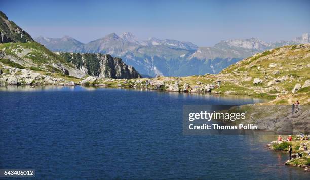 french alps lake and moutain massifs - beaufortain massif stock pictures, royalty-free photos & images