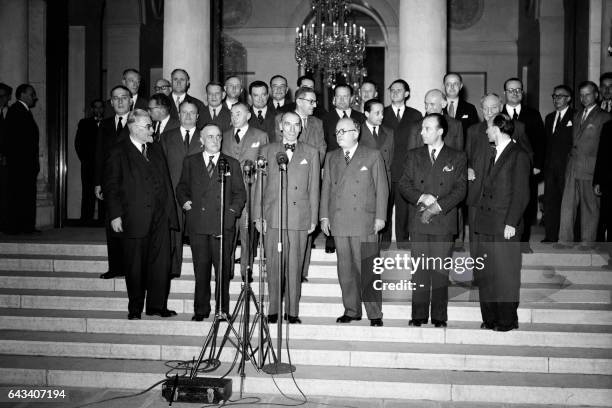 Members of the French government pose for a family picture on July 7, 1948 at the Elysee Palace in Paris. 1st row Minister of State Paul Ramadier,...