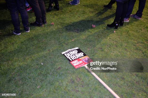 Placard lay in Parliament Square as thousands rally against US president Donald Trump's state visit to the UK on February 20, 2017 in London,...