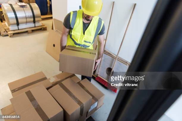 manual worker - picking up stock pictures, royalty-free photos & images
