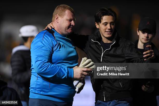 Reserve goalkeeper Wayne Shaw poses for a selfie with a fan after The Emirates FA Cup Fifth Round match between Sutton United and Arsenal at Gander...