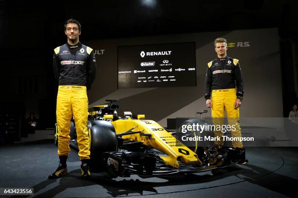 Jolyon Palmer of Great Britain and Renault Sport and Nico Hulkenberg of Germany and Renault Sport pose with the Renault Sport Formula One team's 2017...