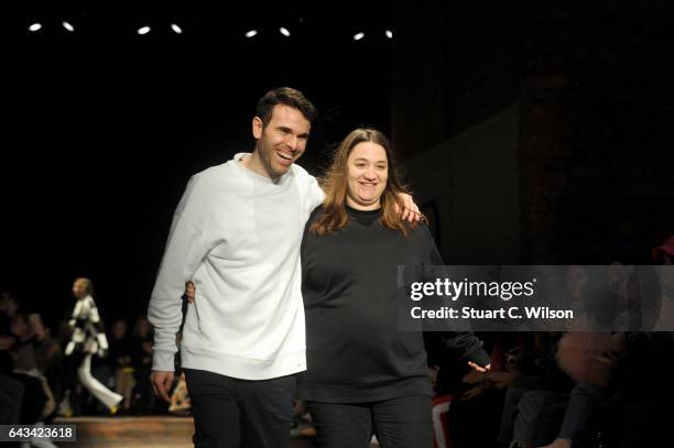 Designers Paulo Almeida and Marta Marques walk the runway following the Marques'Almeida show during the London Fashion Week February 2017 collections...