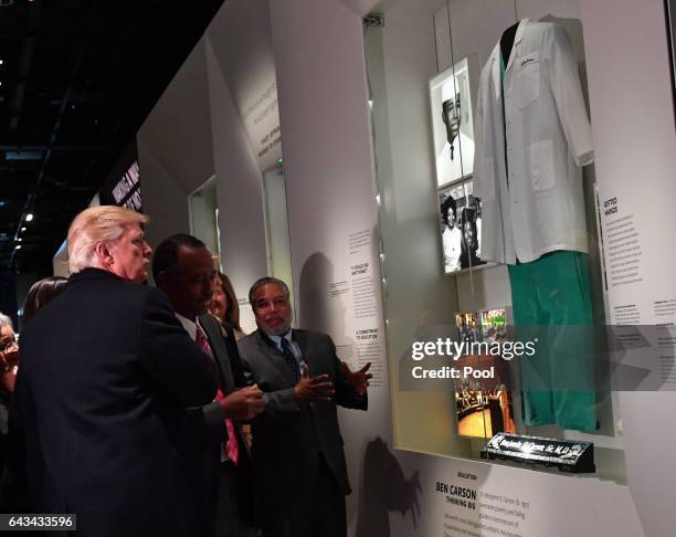 President Donald Trump and Housing and Urban Development nominee Ben Carson look at the Ben Carson exhibit at the Smithsonian National Museum of...