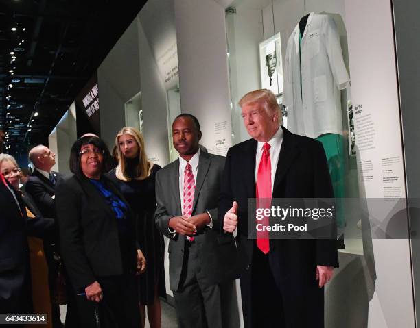President Donald Trump and Housing and Urban Development nominee Ben Carson pose in front of the Ben Carson exhibit during a visit to the Smithsonian...