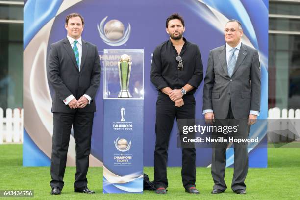 Iain Higgins, COO of the ICC, Shahid Afridi and Fadi Ghosn, Chief Marketing Officer of Nissan Middle East, pose with the Champions Trophy at the ICC...