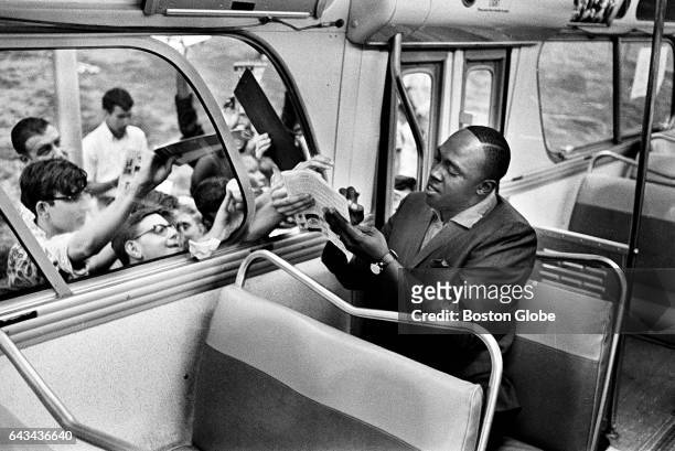 Boston Red Sox first baseman George "Boomer" Scott sign autographs at Logan International Airport in Boston on Sept. 5, 1967.