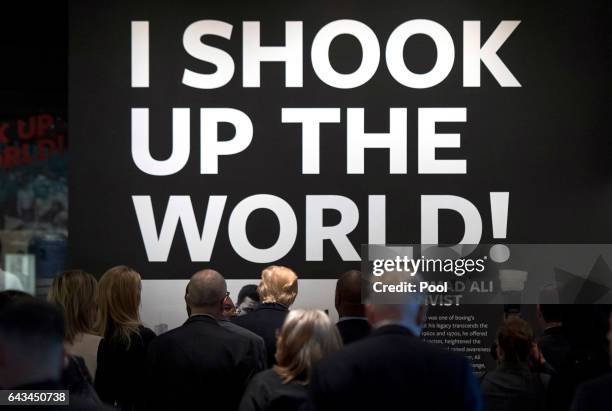 President Donald Trump walks under a quote by Muhammad Alias he tours the Smithsonian National Museum of African American History & Culture on...