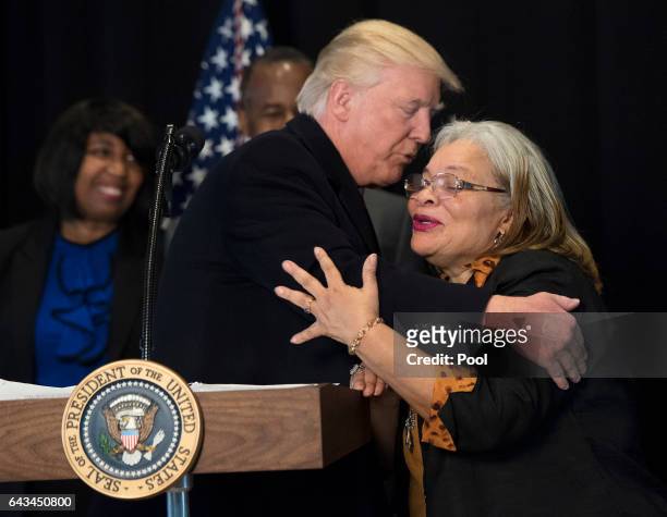 President Donald Trump hugs Alveda King, niece of Martin Luther King Jr., as he delivers remarks after touring the Smithsonian National Museum of...