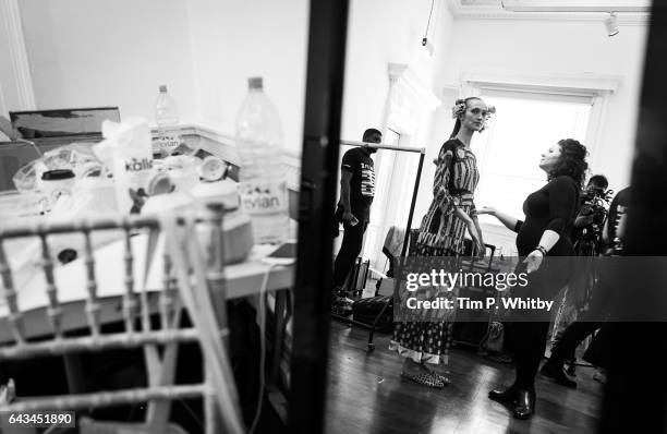 Model is seen refelcted in a mirror backstage ahead of the Taka Naka presentation during the London Fashion Week February 2017 collections at ICA on...