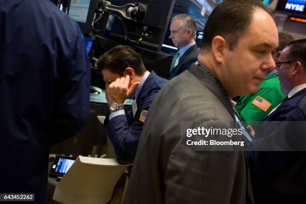 Traders work on the floor of the New York Stock Exchange in New York, U.S., on Tuesday, Feb. 21, 2017. U.S. Stocks rose to records as commodities...