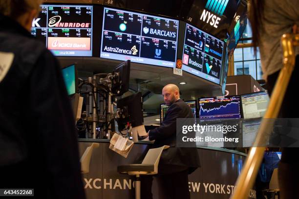 Trader works on the floor of the New York Stock Exchange in New York, U.S., on Tuesday, Feb. 21, 2017. U.S. Stocks rose to records as commodities...