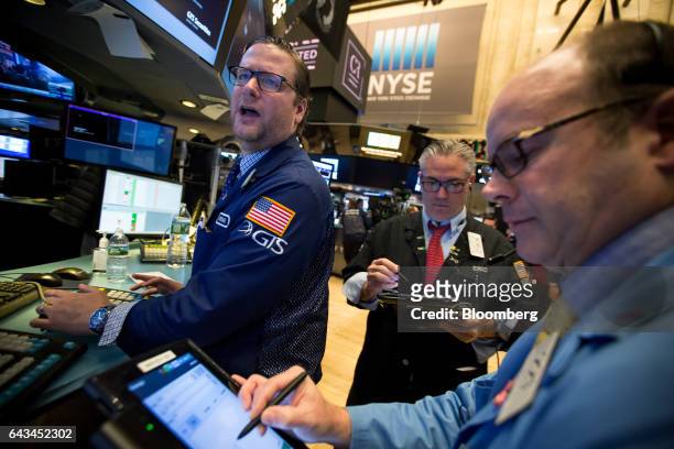 Traders work on the floor of the New York Stock Exchange in New York, U.S., on Tuesday, Feb. 21, 2017. U.S. Stocks rose to records as commodities...