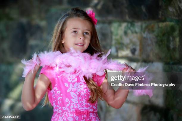 pretty girl in pink dress - with pink feather boa - boa stock pictures, royalty-free photos & images