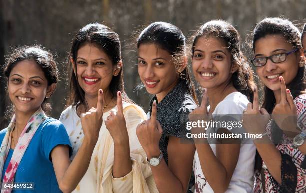 Young voters showing their inked finger after casting their vote during BMC election at Vile Parle on February 21, 2017 in Mumbai, India. Mumbai...