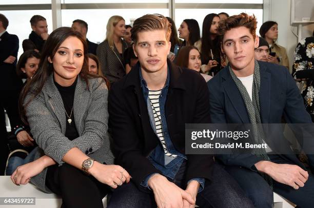 Roxie Nafousi, Toby Huntington-Whiteley and Isaac Carew attend the Jigsaw London Fashion Week show on February 21, 2017 in London, England.