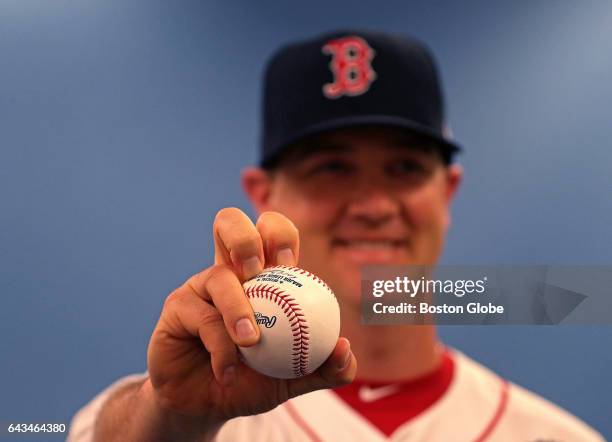 Boston Red Sox starting pitcher Steven Wright demonstrates his knuckleball grip for a photo during a Picture Day photo session on day seven of Red...