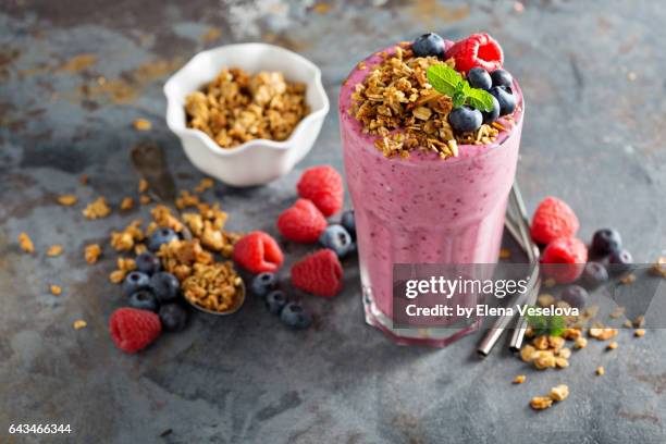berry smoothie in a tall glass - blueberries fruit fotografías e imágenes de stock
