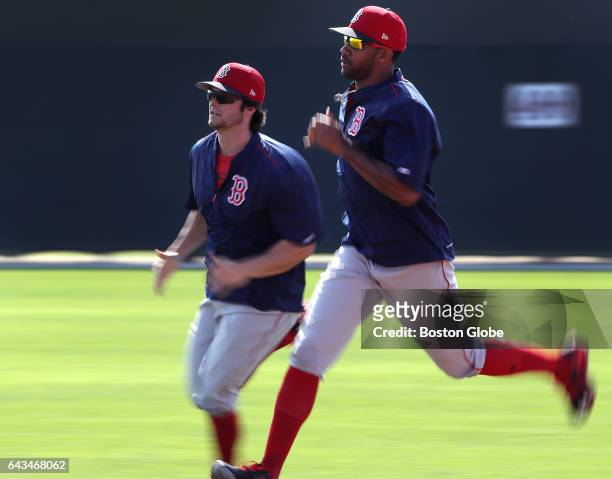 Boston Red Sox left fielder Andrew Benintendi and Boston Red Sox outfielder Chris Young run the bases during a drill on day six of Red Sox Spring...
