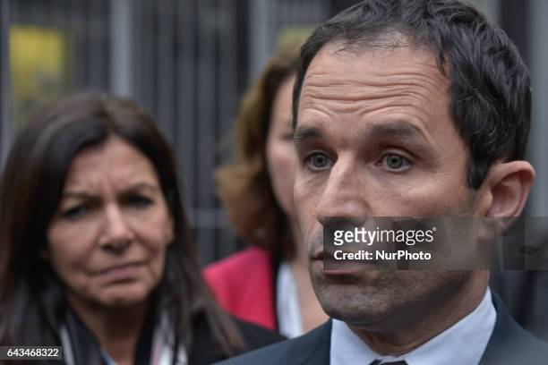 French presidential election candidate for the left-wing French Socialist party Benoit Hamon answers to the press during a visit to the Memorial de...