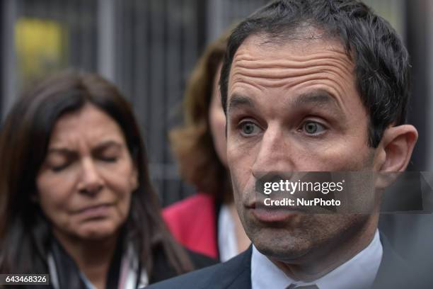 French presidential election candidate for the left-wing French Socialist party Benoit Hamon answers to the press during a visit to the Memorial de...