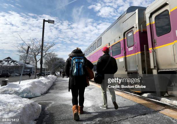 Passengers get off an MBTA commuter rail train from Boston in Manchester-by-the-Sea, MA on Feb. 18, 2017.