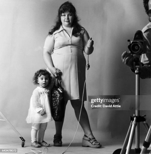 An Unidentified woman and her daughter are set up by photographer David Attie to take their own picture for Attie's book 'Russian Self-Portraits' in...
