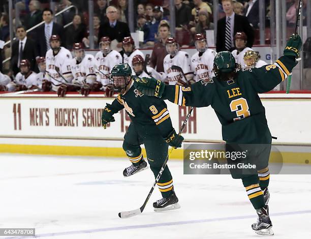 The Boston College bench watches University of Vermont's Brian Bowen celebrate his wrap around game tying goal with teammate Mike Lee during the...