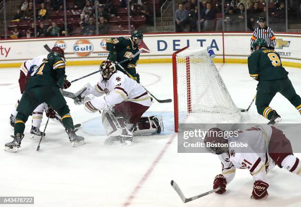 Boston College goalie Joseph Woll is out of position as University of Vermont's Brian Bowen makes a game tying wrap around goal during the second...