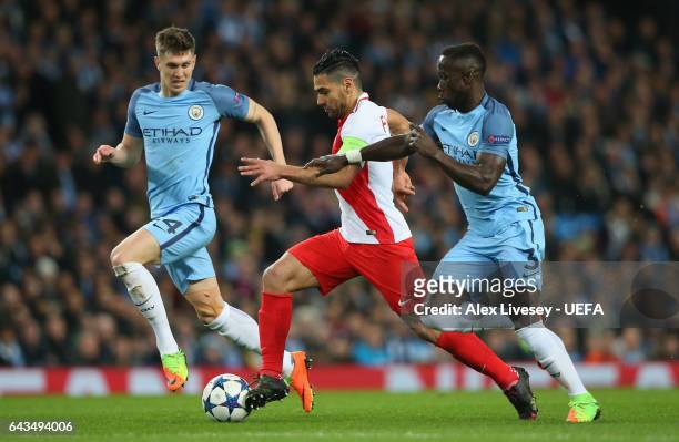 Radamel Falcao of AS Monaco battles for the ball with John Stones and Bacary Sagna of Manchester City FC during the UEFA Champions League Round of 16...